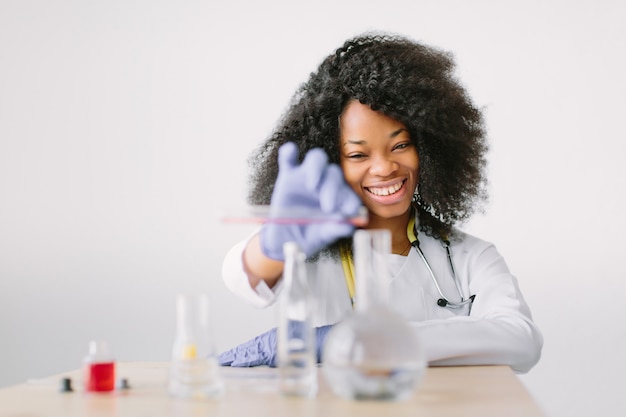 Young beautiful  girl doctor in a white coat with a stethoscope. 