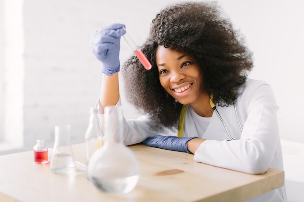 Young beautiful  girl doctor in a white coat with a stethoscope. 