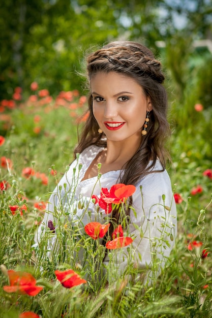 Young beautiful girl in the field