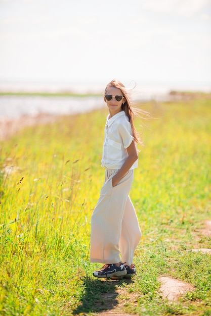 Young beautiful girl having fun on the coast