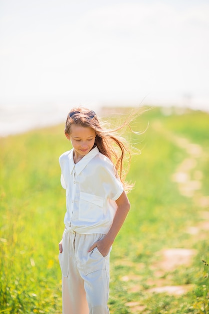 Young beautiful girl having fun on the coast