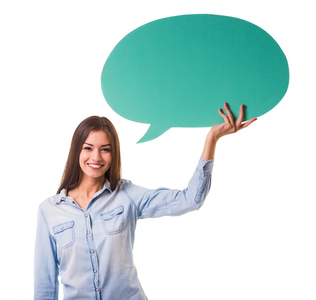 Young beautiful girl holding a green bubble for text.