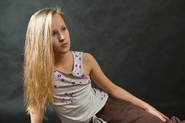 Young beautiful girl in a knitted suit