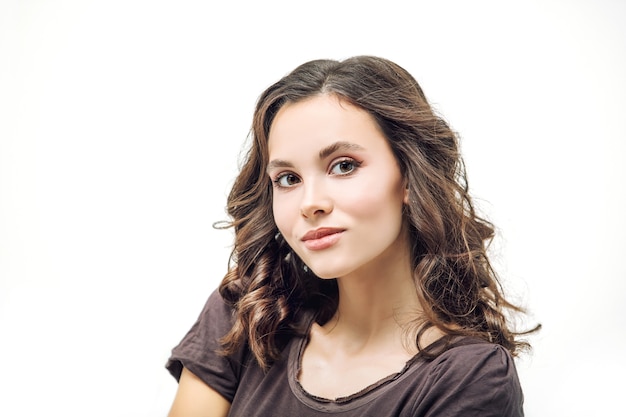 Young beautiful girl model with makeup and hairstyle beauty portrait in Studio on white background