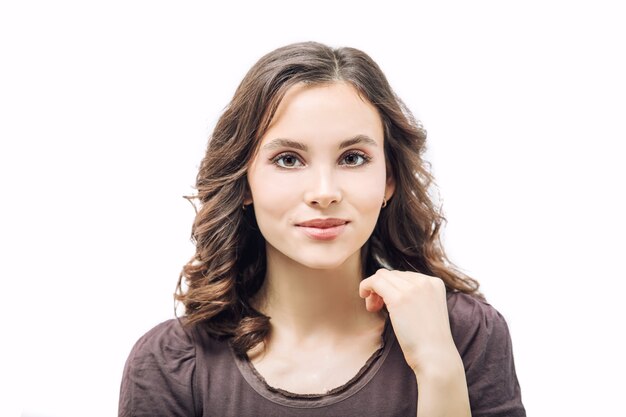 Young beautiful girl model with makeup and hairstyle beauty portrait in Studio on white background