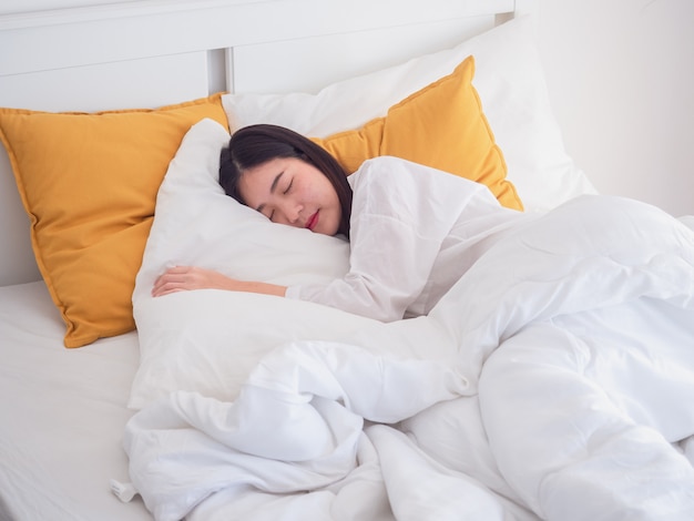 Young beautiful girl sleeping in bedroom