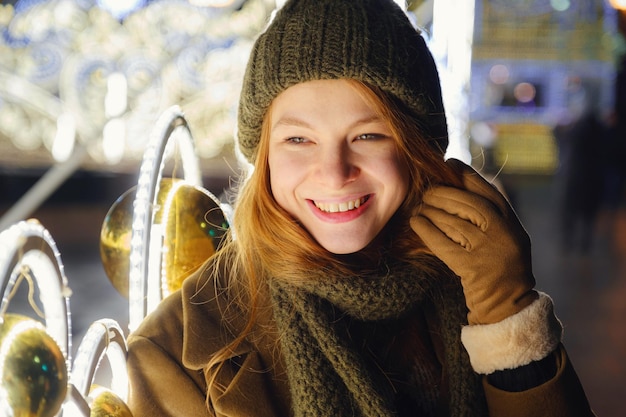 Young beautiful happy smiling woman posing on the street