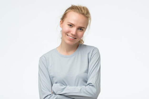 Young beautiful happy woman looking at camera with smile