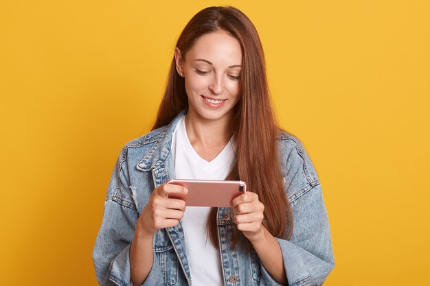 Young beautiful happy woman using smart phone