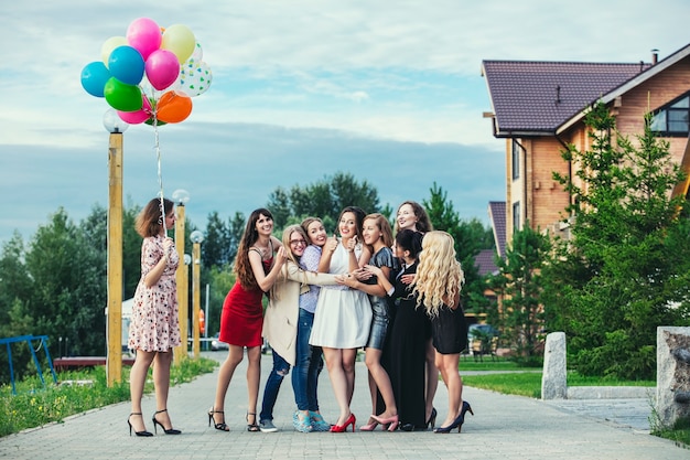 Young beautiful happy women celebrate bachelorette party at the pier