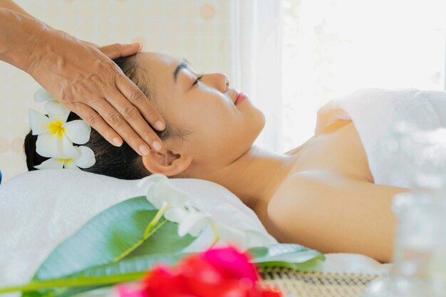 Young beautiful and healthy woman in massaging salon