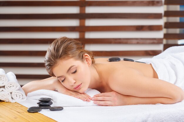 Young, beautiful and healthy woman in spa salon.