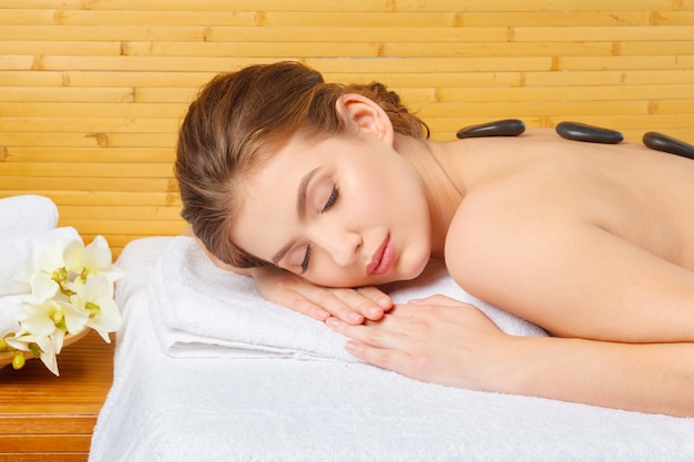 Young, beautiful and healthy woman in spa salon.