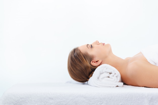 young, beautiful and healthy woman in spa salon.