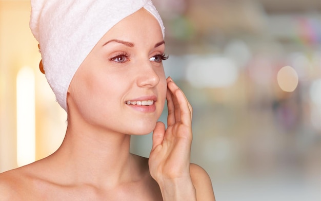 Young beautiful healthy woman with white towel