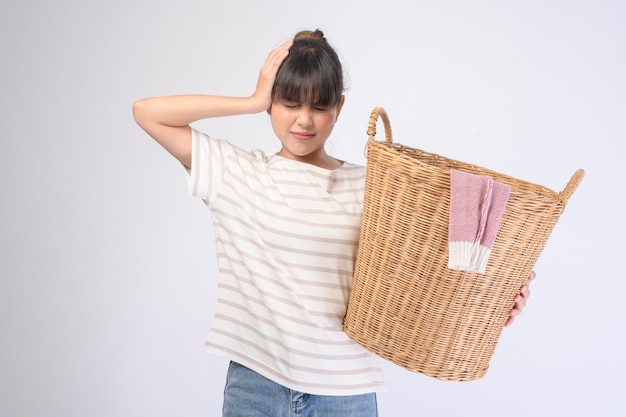 A young beautiful housewife smiling on white background