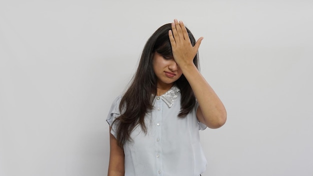 Young beautiful Indian woman over isolated background suffering from headache