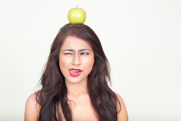  young beautiful Indian woman wearing underwear as healthy concept against white wall