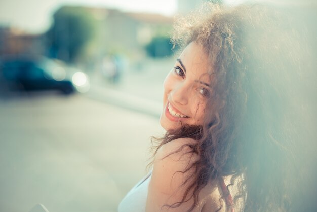 young beautiful long curly hair hipster woman