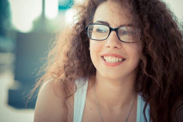 young beautiful long curly hair hipster woman