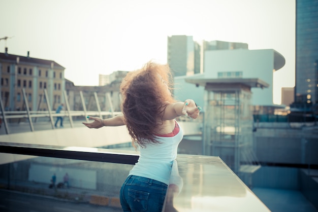 young beautiful long curly hair hipster woman