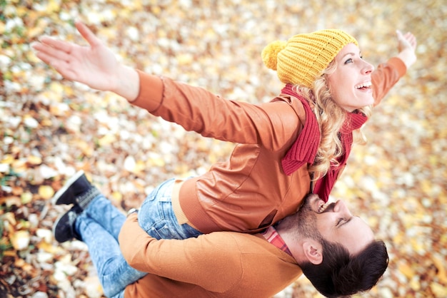 Young  beautiful loving couple in autumn park.