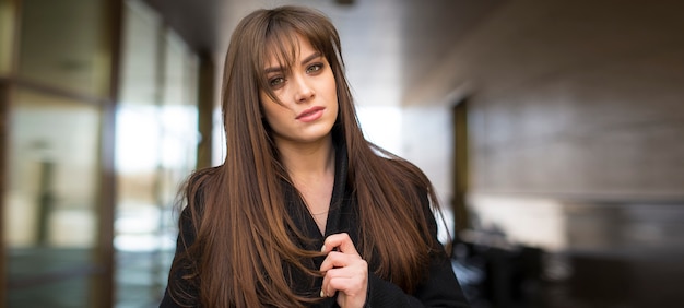 Young beautiful model posing at the street