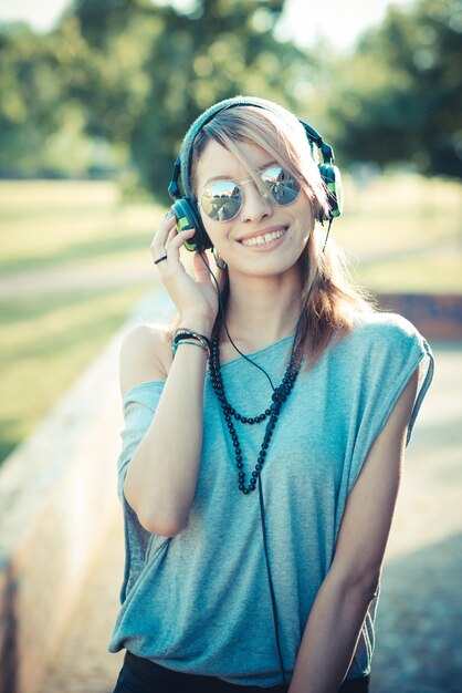 young beautiful model woman listening music