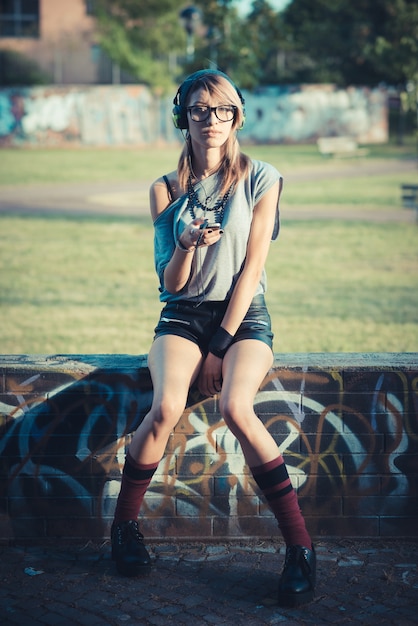 young beautiful model woman listening music