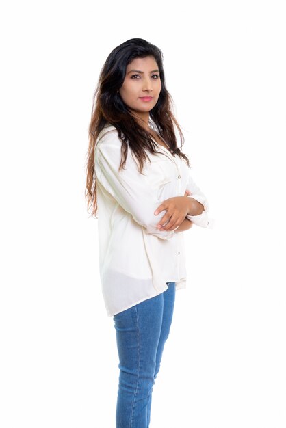 young beautiful Persian woman standing with arms crossed