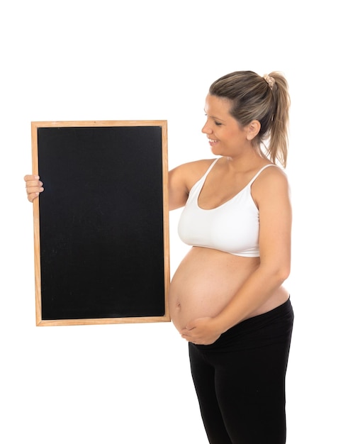 Young beautiful pregnant girl holding white empty blackboard isolated on a white