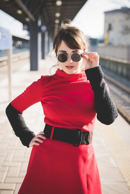 young beautiful red dressed vintage hipster woman