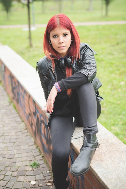 young beautiful red hair venezuelan woman lifestyle listening music