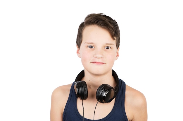 Young beautiful smile teenager boy with headphones on head isolated over a white background