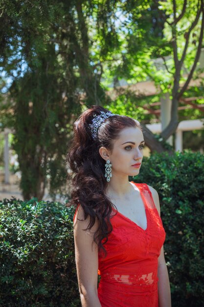 Young beautiful stylish girl walking and posing in city. Outdoor summer portrait of young classy woman