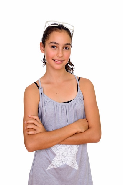 young beautiful teenage girl wearing sleeveless dress isolated against white space