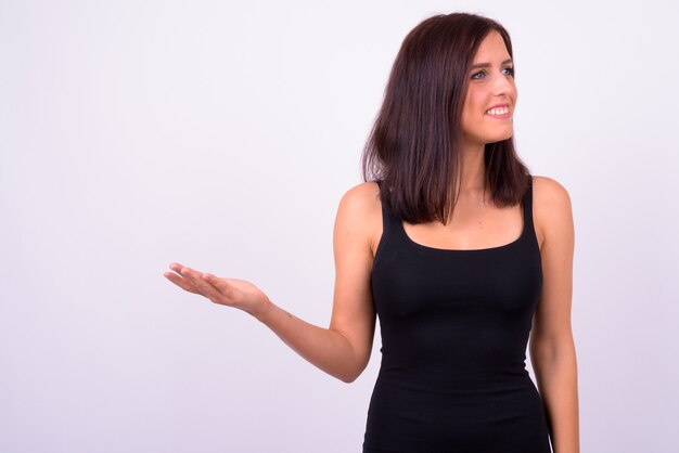  young beautiful woman against white wall