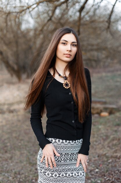 Young beautiful woman in a black blouse