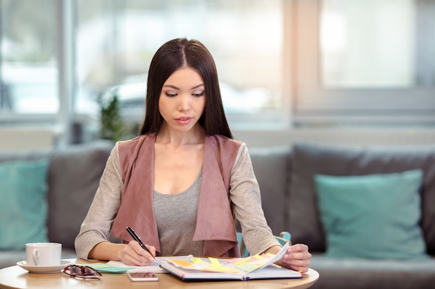 Young beautiful woman in cafe