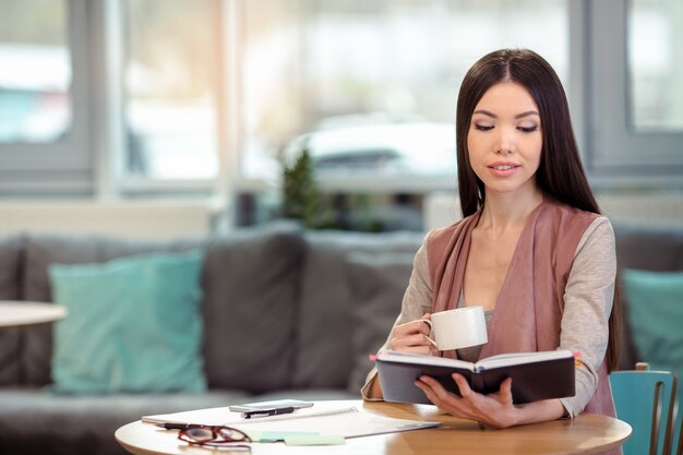 Young beautiful woman in cafe