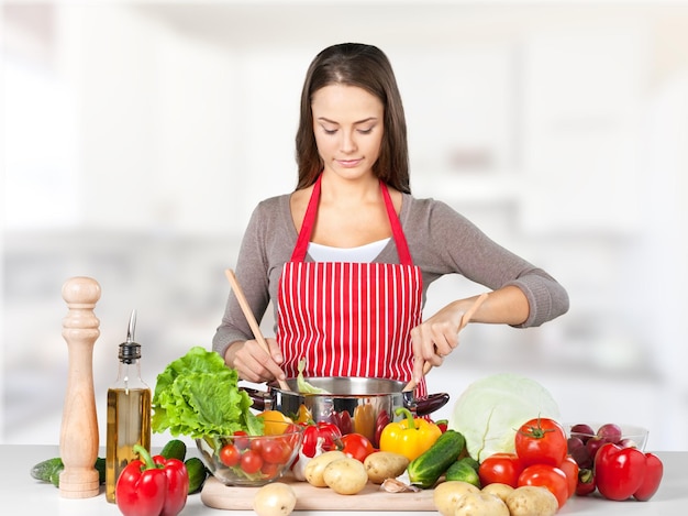 Young beautiful woman Cooking in kitchen