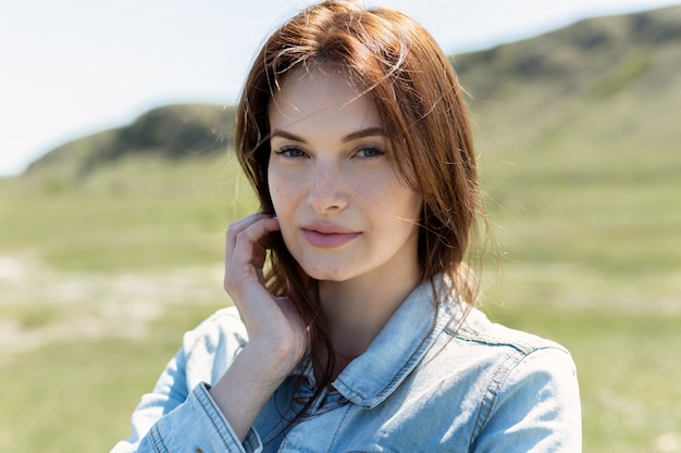 Young beautiful woman in the countryside