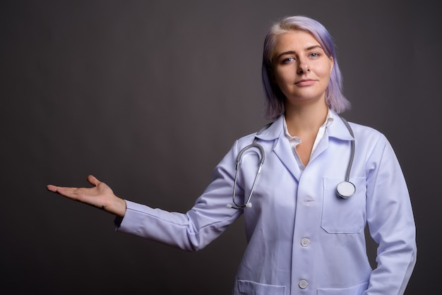 young beautiful woman doctor with short colorful hair