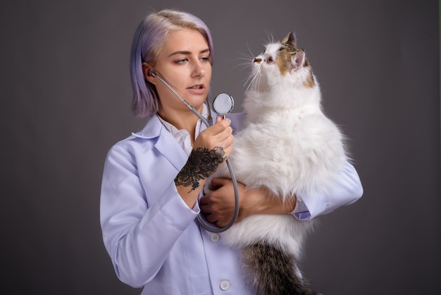 young beautiful woman doctor with short colorful hair