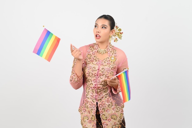 Young beautiful woman dress up in local culture in southern region with rainbow flag