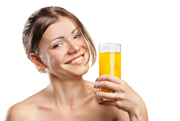 Young beautiful woman drinking orange juice isolated on a white background