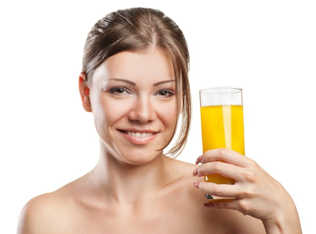 Young beautiful woman drinking orange juice