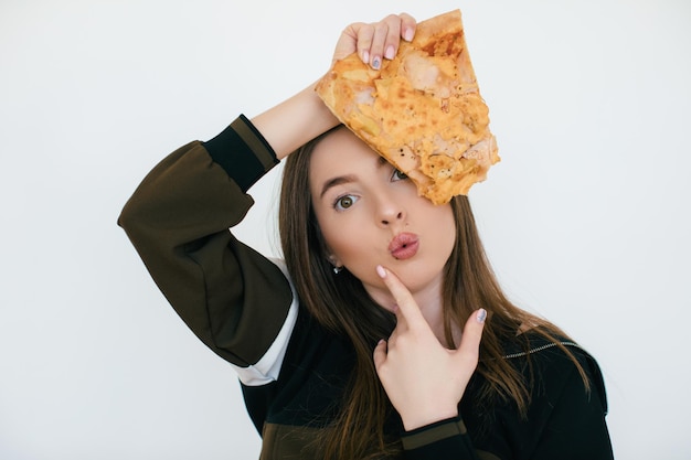 Young beautiful woman eat slice of pepperoni pizza