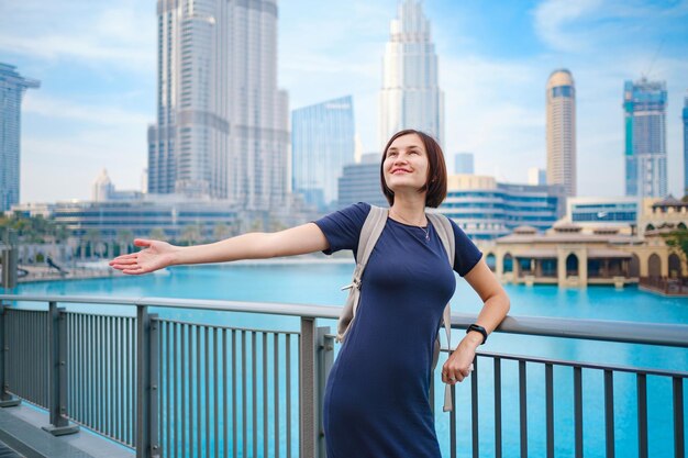 Young beautiful woman enjoying the view of Dubai downtown