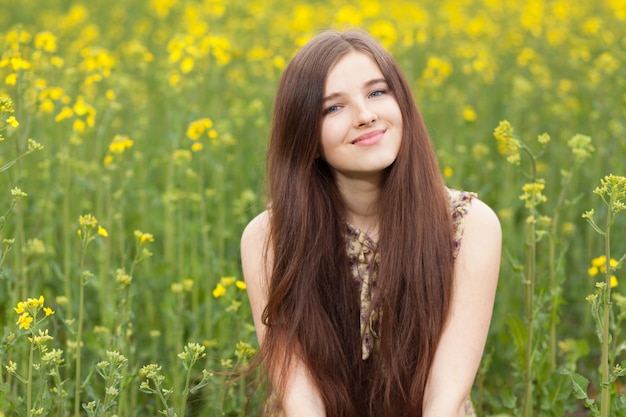 Young beautiful woman in the fields